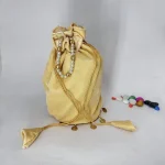 DESIGNER VELVET ROUND SHAPED PLAIN WITH SIKKA ZUMKA LACE ON BOTTOM ROUND POTLI PURSE CREAM