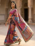 TRENDING ROMAN SILK AJARAKH PRINT AND REAL MIRROR WORK WITH PIPING BORDER WORK SAREE WITH UNSTITCHED BLOUSE PARTY WEAR WHOLESALE PRICE EHNIC GARMENT (4)