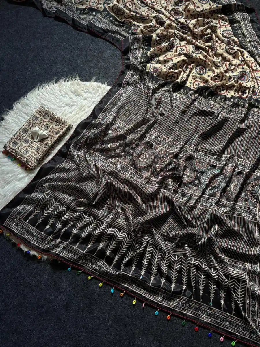 FANCY ROMAN SILK AJARAKH PRINT AND REAL MIRROR AND PIPING BORDER & PALLU ALSO KODI LATKAN WORK SAREE WITH UNSTITCHED BLOUSE FESTIVE WEAR WHOLESALE PRICE ETHNIC GARMENT (9)